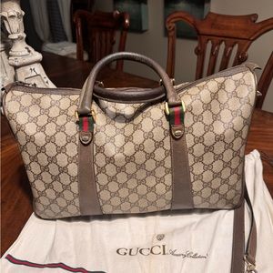Pre-owned and very loved vintage Gucci bag